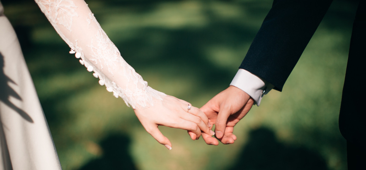 A couple getting married in France holding hands