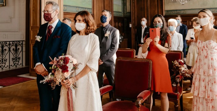 A civil wedding ceremony taking place in a French town hall